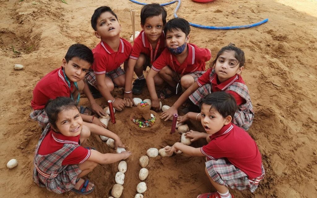 students-playing-with-mud